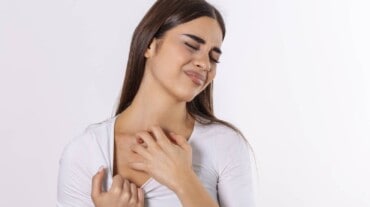 A woman itching her neck
